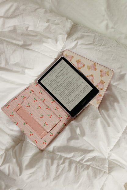 Pink floral e-reader case on a white surface