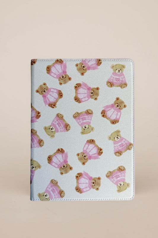 Kindle Case with teddy bear pattern on a cream background.